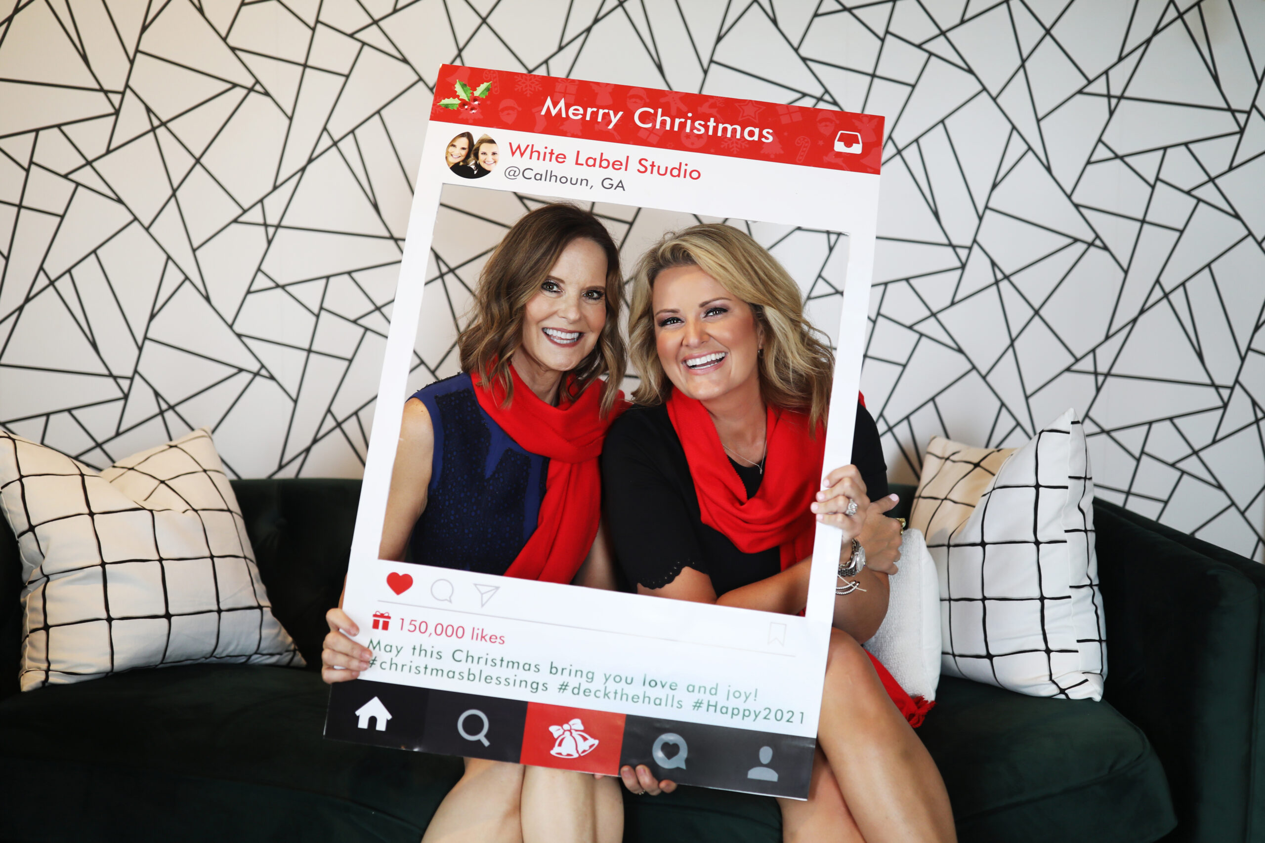 two women holding holiday social media frame