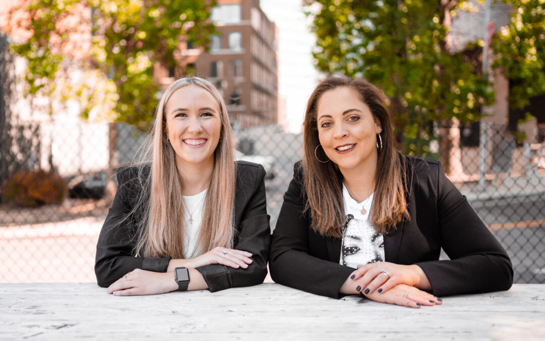 two business women with city background